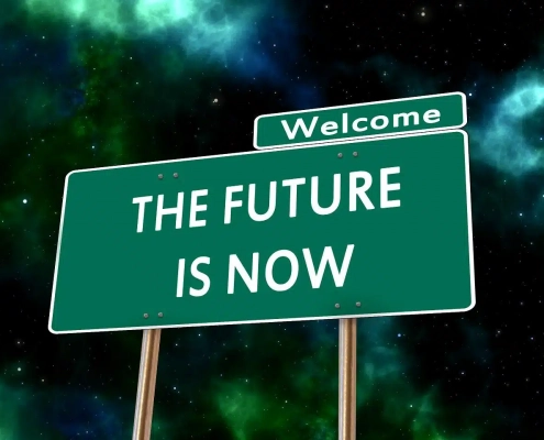 Schild vor Nachthimmel: "THE FUTURE IS NOW"