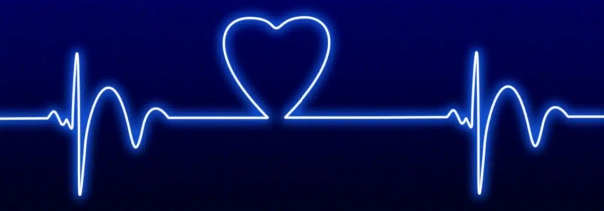 Neonlinie mit einer Herzfrequenz und einem Herz als Ausschlag