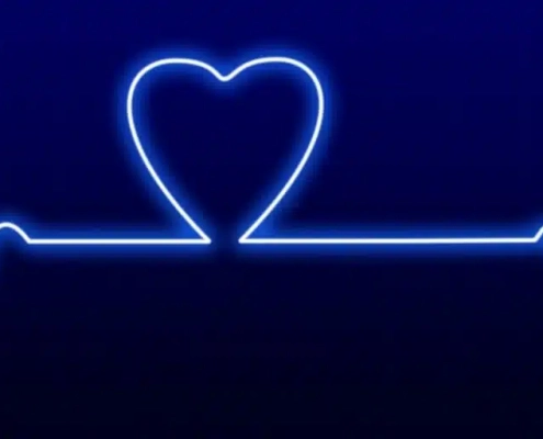 Neonlinie mit einer Herzfrequenz und einem Herz als Ausschlag